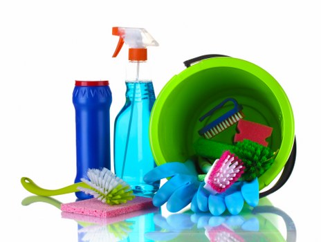 Professional oven cleaning service with safety equipment and cleaning products