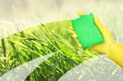 Professional home cleaners in Fulham cleaning a modern living room