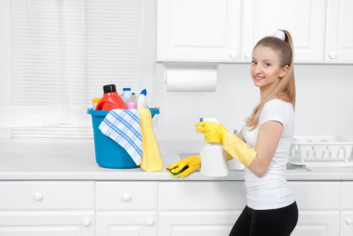 Technician preparing an oven cleaning appointment with tools and supplies